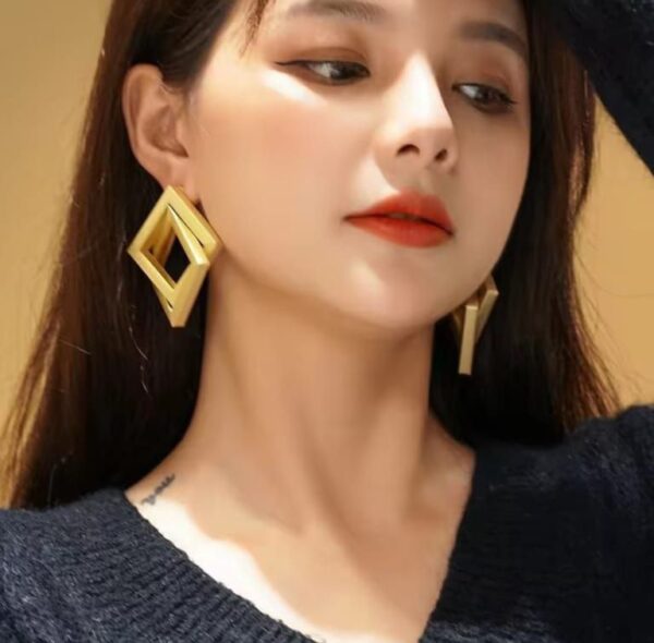Golden Criss Cross Earrings - Image 3